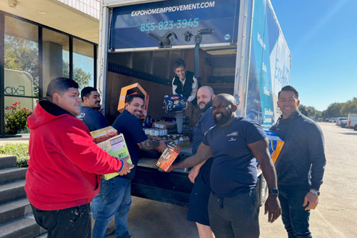 Volunteers helpign unload a truck