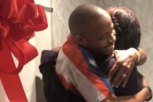 Man hugging a child.